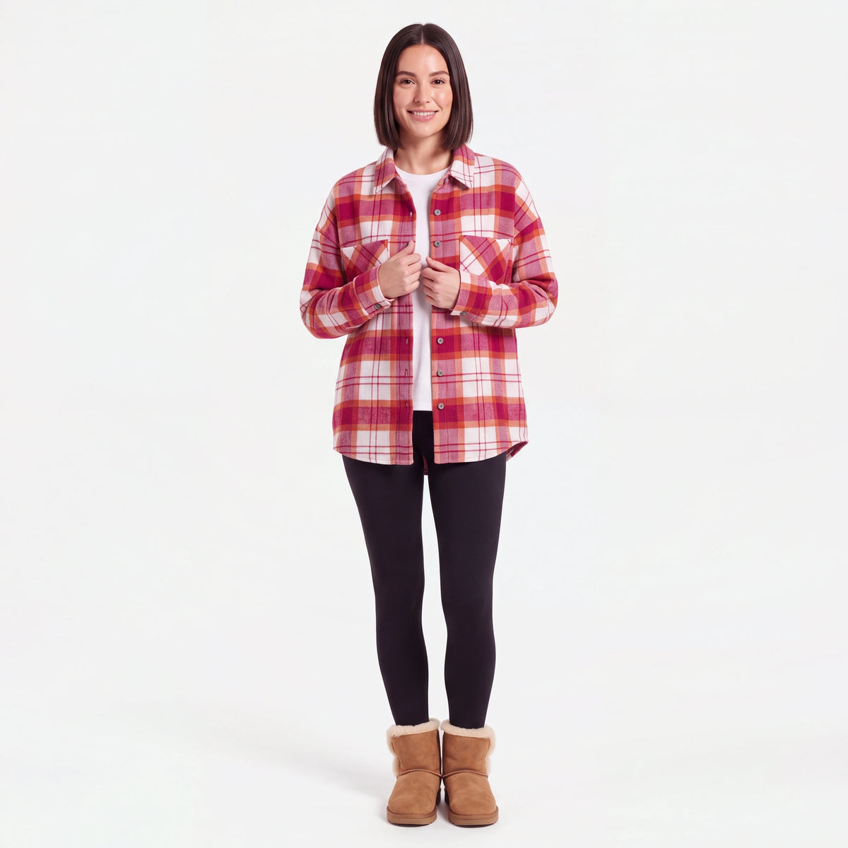 Woman wearing the Pink Plaid flannel shacket with leggings