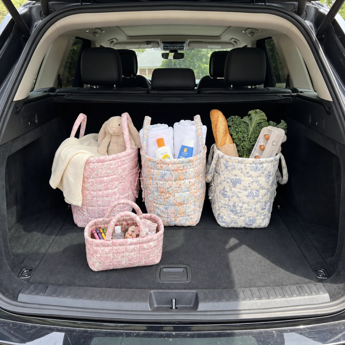 Mini Quilty Blush Rose in the car trunk next to Quilty