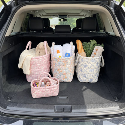 Mini Quilty Blush Rose in the car trunk next to Quilty