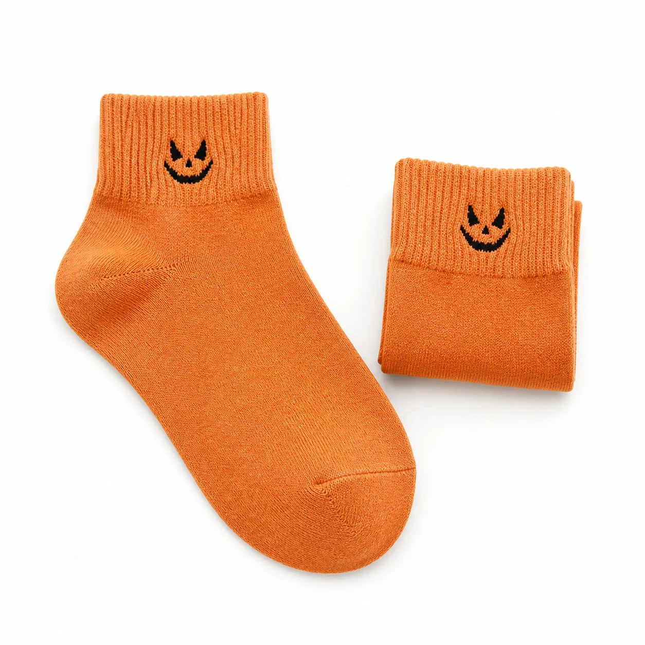 Spooky Halloween ankle socks, orange with black jack-o'-lantern face
