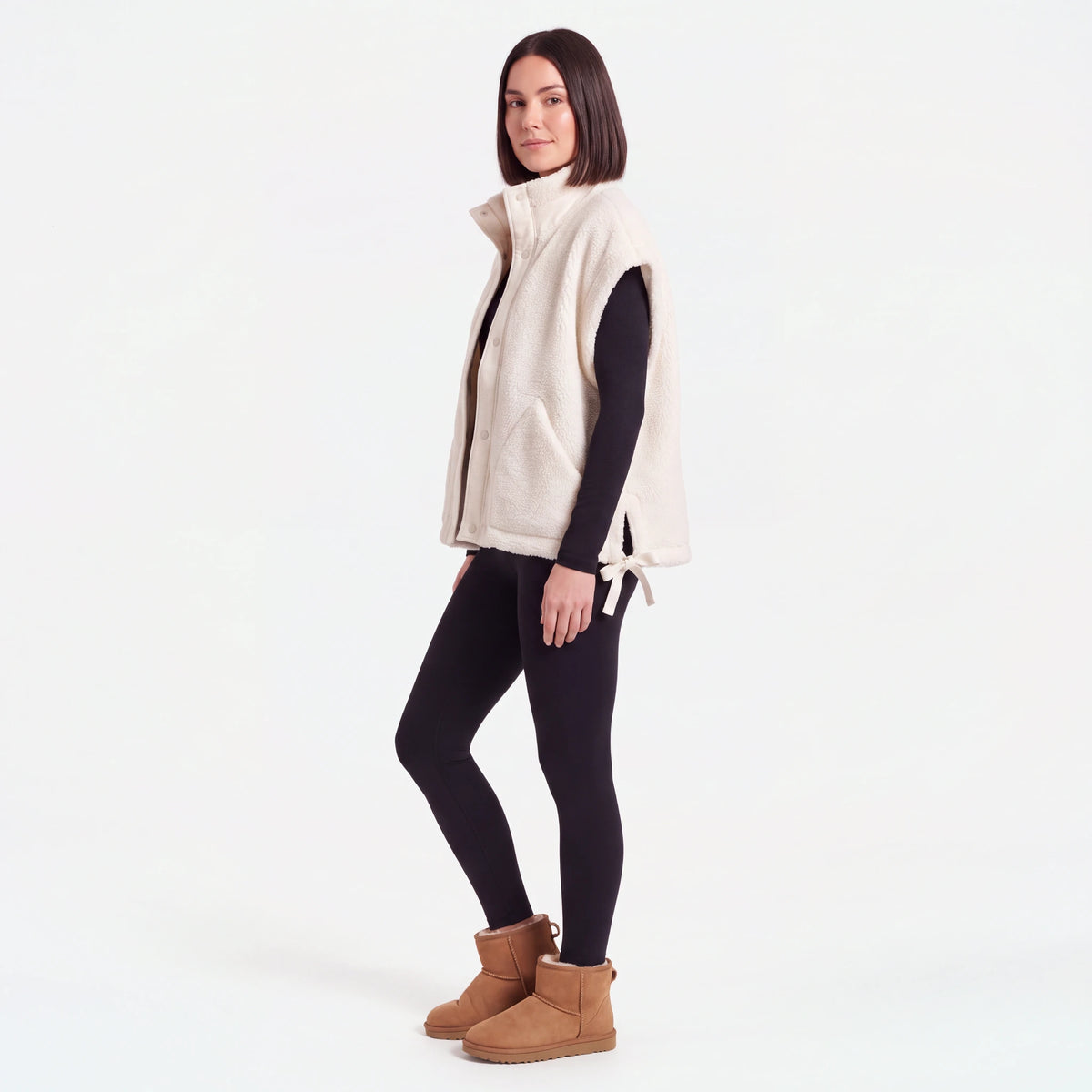 Oversized Sherpa Vest, Cream, side view with the side slit and bow